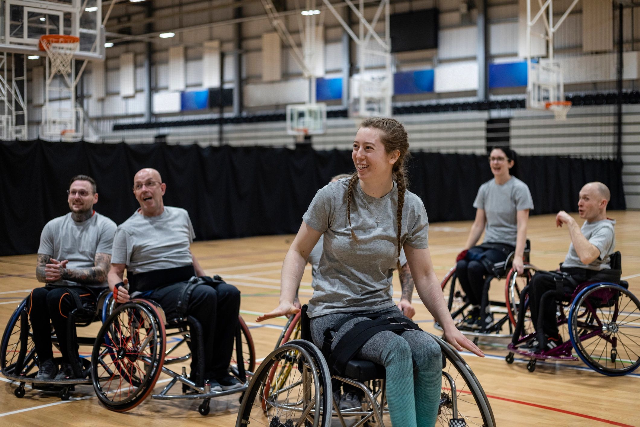Wheelchair users enjoying a friendly community basketball game