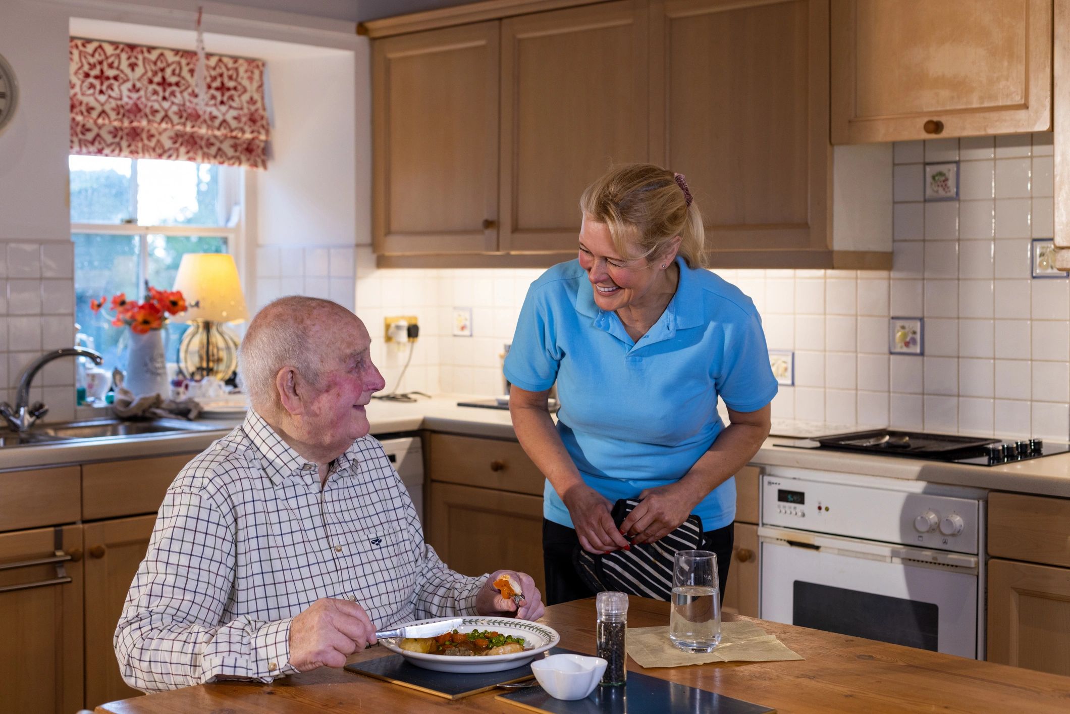 Support worker assisting a participant at home