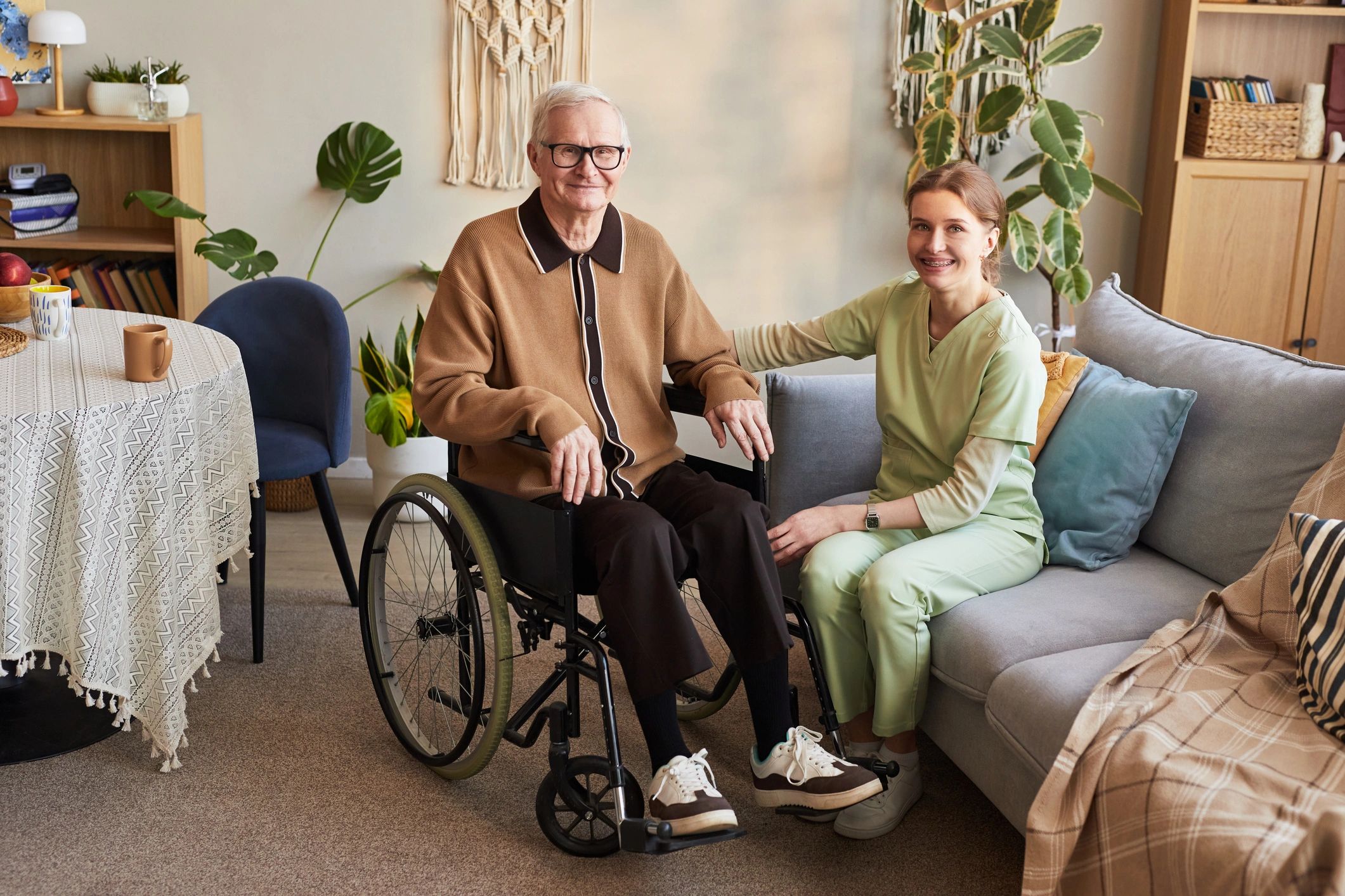 Participant with caregiver receiving supportive personal care