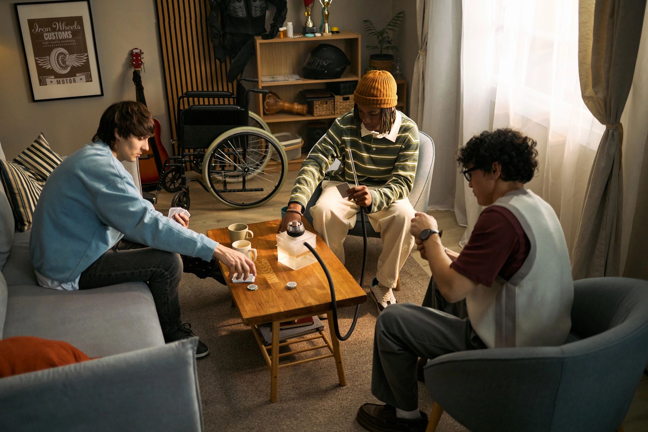 Young people playing a board game together at home